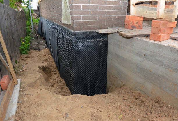 SJ Waterproofing Pros technician performing targeted Exterior Waterproofing assessment in Coleman, MI
